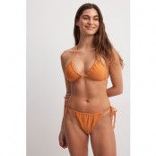 NA-KD Swimwear Bikinitrosa med hög skärning och knytning - Orange